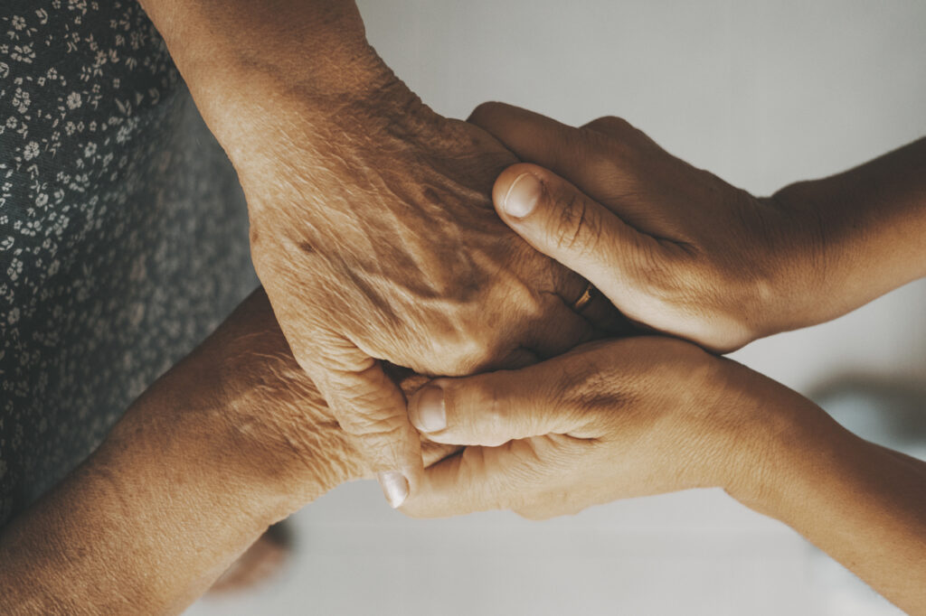 life insurance service holding hands elderly people